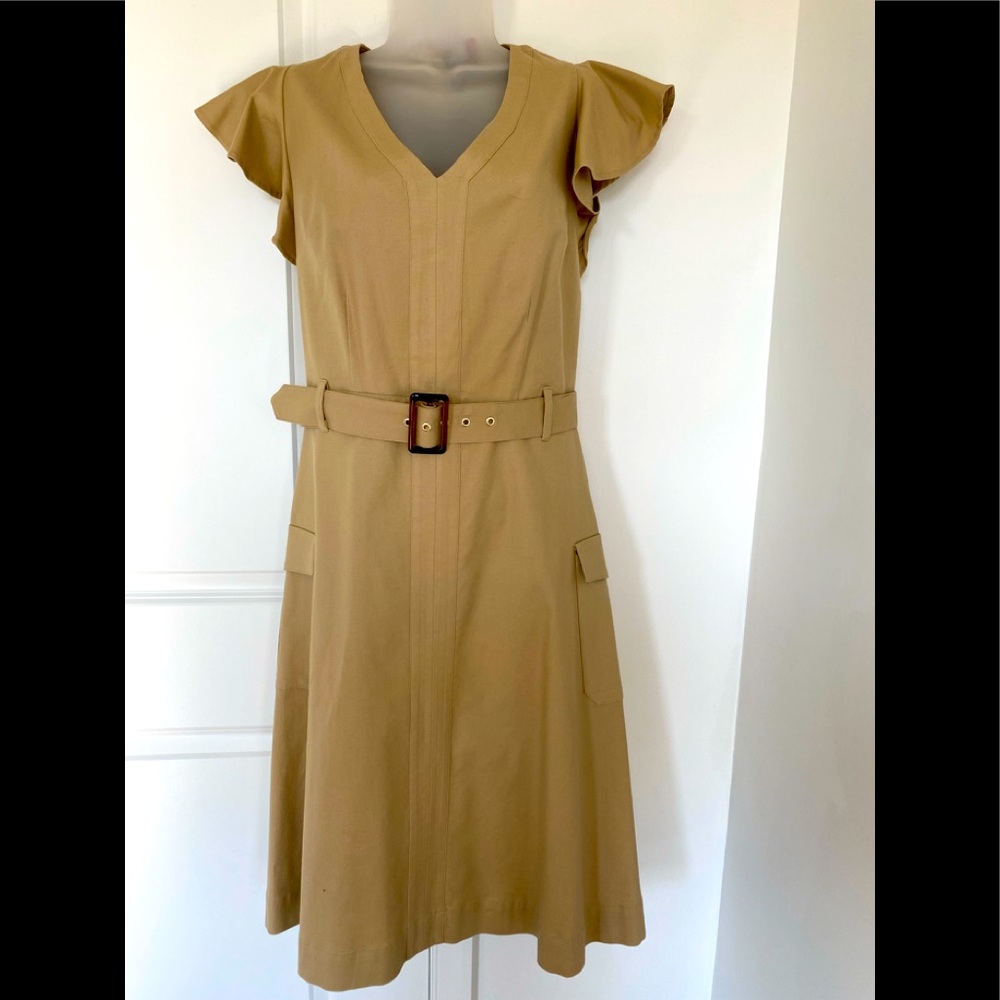 Casual woman’s dress with ruffled shoulders, knee length with belt